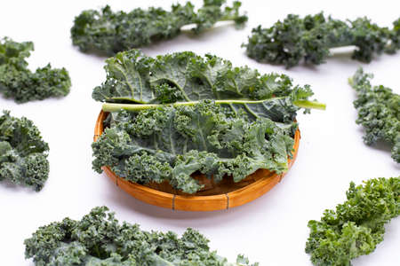 Kale leaves on white background. Top viewの写真素材