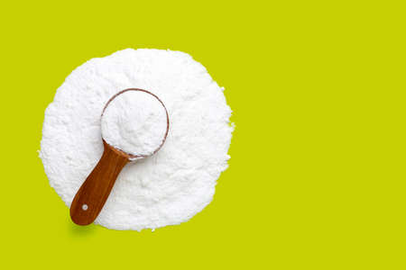 Baking soda on green background.の写真素材