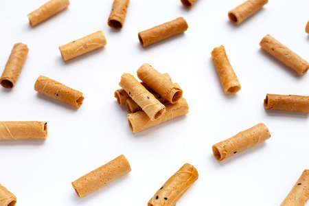 Thai crispy coconut rolls on white background.の写真素材