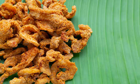 Fried crispy pork belly recipe on banana leafの写真素材