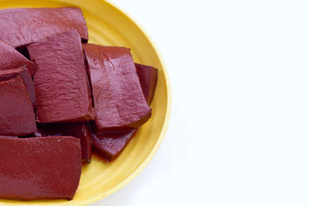 Pork blood pudding in yellow plate on white background.の写真素材