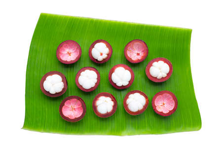 Mangosteen on banana leaf on whiteの写真素材