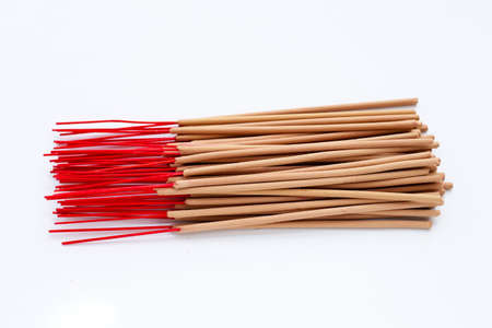 Stack of incense sticks on white background.の写真素材