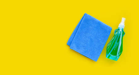 Window cleaner in plastic bottle with blue towelの写真素材