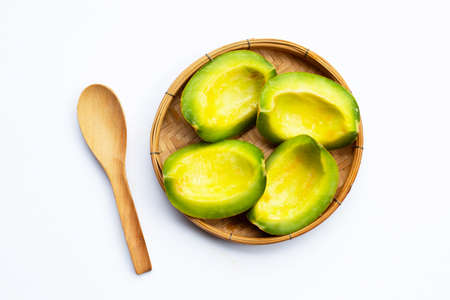 Tropical fruit, Thai cantaloupe or Muskmelon sliced in bamboo basket on whiteの写真素材