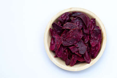 Purple sweet potato chips on white background.の写真素材