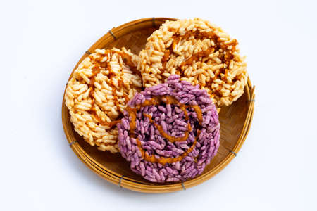 Rice cracker with coconut palm sugar on whiteの写真素材