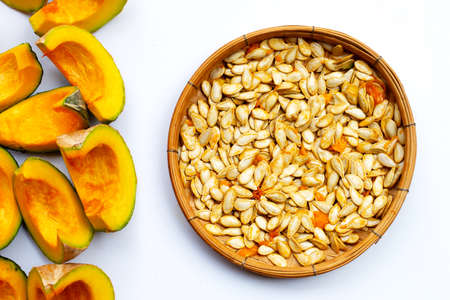 Green pumpkin seeds on white background.の写真素材