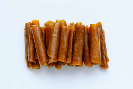 Dried mango paste on white background.の写真素材