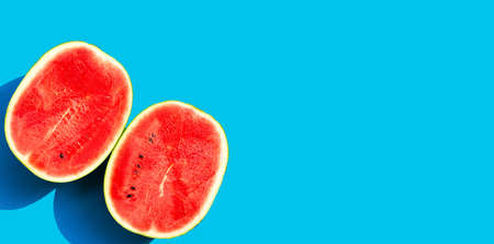 Watermelon on blue background. Copy spaceの写真素材