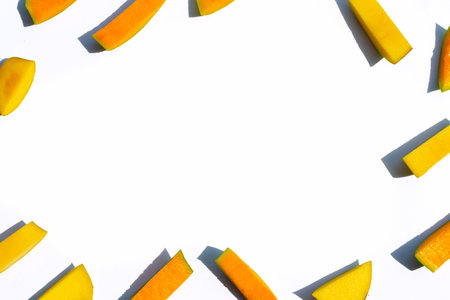 Frame made of mango cut pieces on white background.の写真素材
