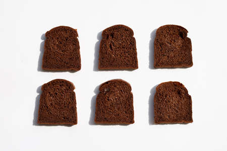 Dark cocoa bread on white background.