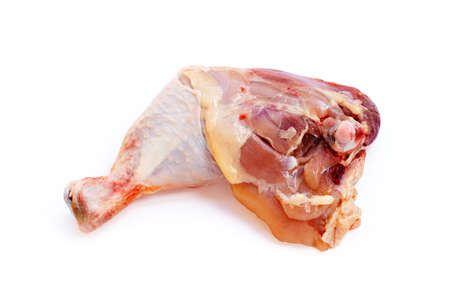 Raw chicken leg on white backgroundの写真素材