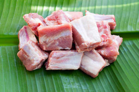 Raw pork ribs on banana leaf backgroundの写真素材