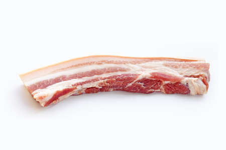 Streaky pork in white plate on yellow background.の写真素材