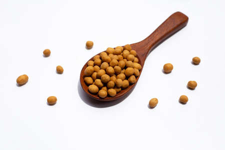 Crispy peanut snack balls on white background.