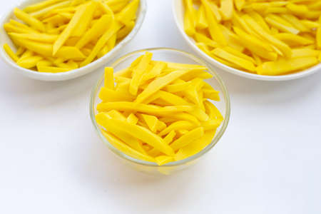Preserved bamboo shoot in bowl on white background.