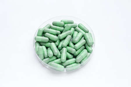 Green capsules on white backgroundの写真素材