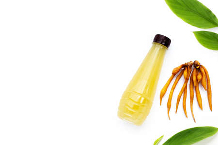 Fresh fingerroot with bottle of finger root juice on white background.の写真素材