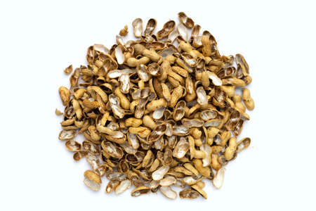 Pile of peanut shells on white