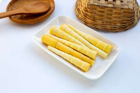 Bamboo shoots in white plate on white background.