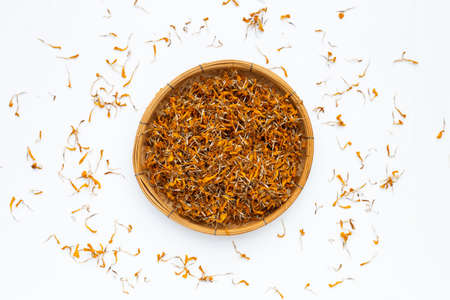 Dried marigold flower petals on white background. Flower herbal tea concept.