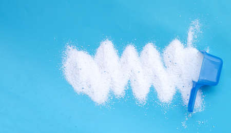 Detergent powder with measuring spoon for clothes washing. Laundry concept.の写真素材