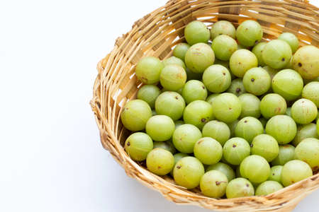 Fresh emblica in bamboo basket on white background.の写真素材