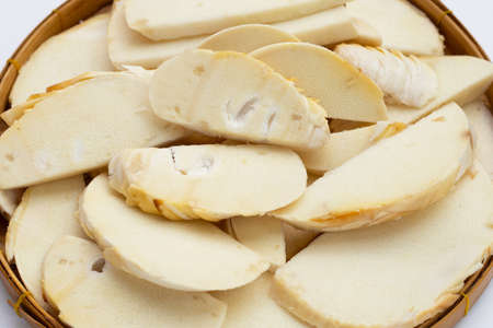 Bamboo shoots in bamboo basket on white backgroundの写真素材