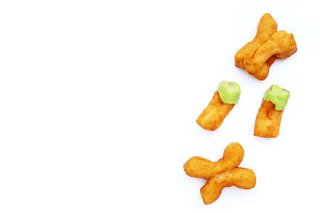 Deep-fried dough stick or chinese bread stick with steamed custard on white background.の写真素材