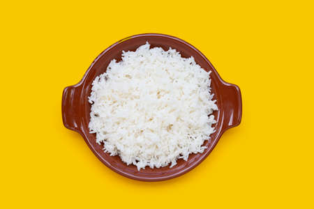 Bowl of rice on yellow background.の写真素材