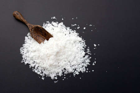 White salt on dark background.