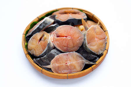 Catfish cut pieces in bamboo basket on white background.の写真素材