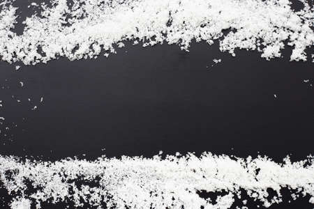 Frame made of salt on dark background.の写真素材
