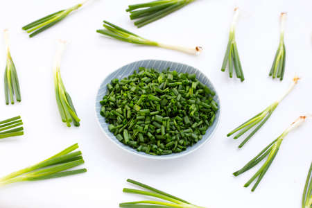 chopped spring onions on white backgroundの写真素材