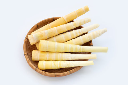 Bamboo shoots in bamboo basket on white background.の写真素材
