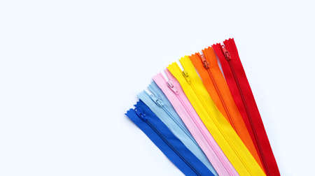 Zippers for clothing on white background.