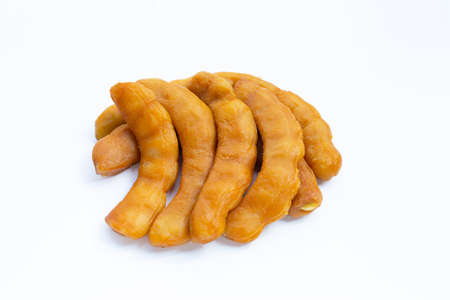 Tamarind pickled fermented on white background.の写真素材