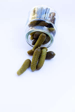 Pickled gherkins or cucumbers on white background.の写真素材