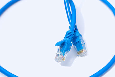 LAN network connection blue cables on white background.