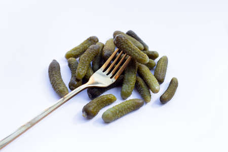 Pickled gherkins or cucumbers on white background.の写真素材
