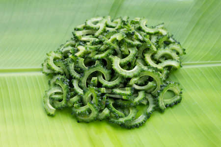 Sliced bitter gourd on banana leaf