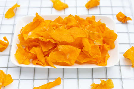 Sweet potato chips on white background.