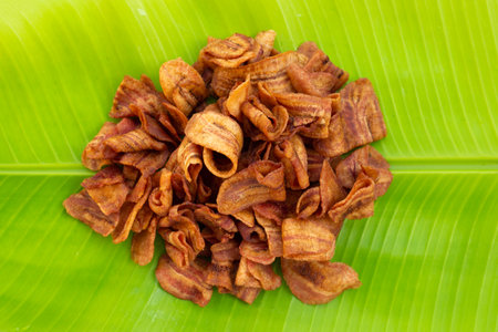 Banana slice chips on banana leafの写真素材