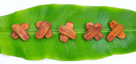 Sun dried bananas on banana leafの写真素材