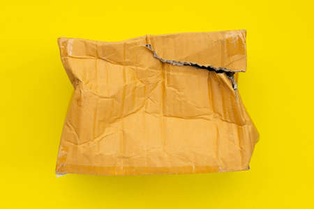 Damaged cardboard box with holeの写真素材