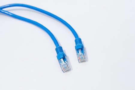 LAN network connection ethernet blue cables on white background.