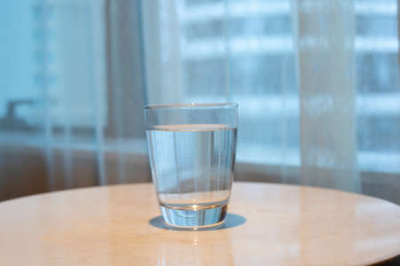 Galss of water on tableの写真素材