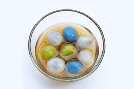 Black sesame dumpling in ginger tea recipes in glass bowl on white background.