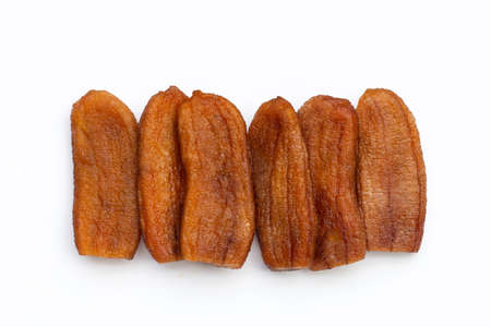 Sun dried bananas on white background.の写真素材